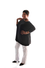 curvy model wearing our white bootleg pants