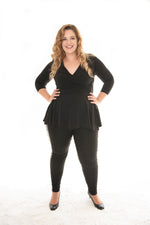 plus size model posing in our black carriere top