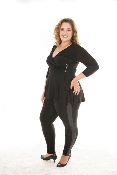 side view of plus size model posing in our black carriere top
