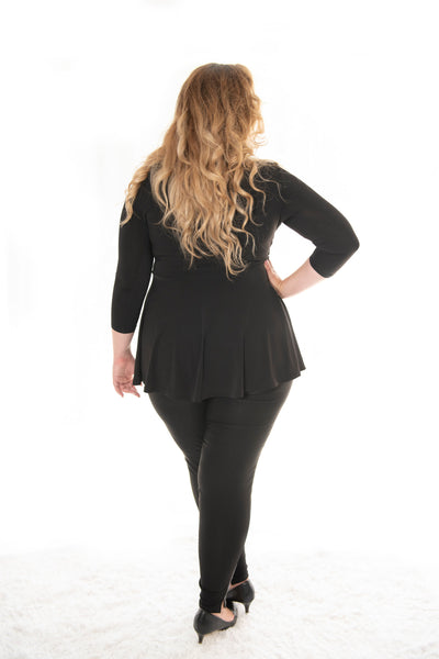 back view plus size model posing in our black carriere top