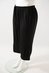 side view of black knit pj pants with three quarter length on the mannequin