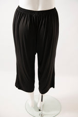 back view of black knit pj pants with three quarter length on the mannequin