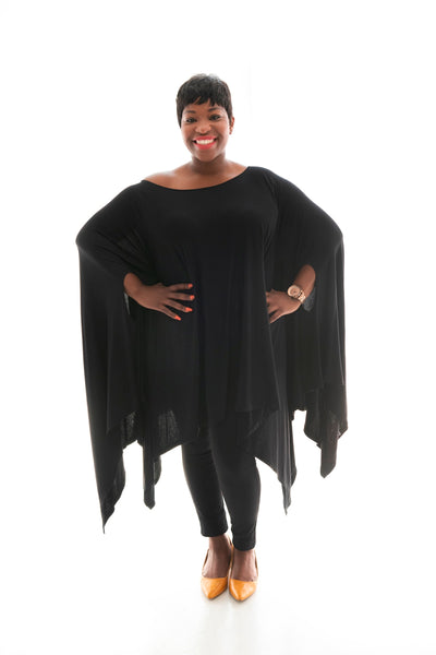 lady with superhero pose in our black angelica poncho