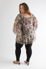 back view of gal in our rose print sophia top