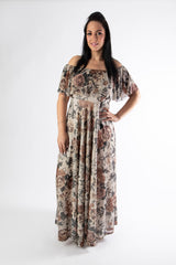 Buxom lady wearing our sophia maxi dress in a rose print
