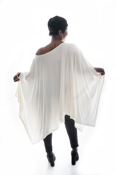 back view of a model in our white angelica poncho