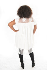 back view of a model wearing our winter white annabelle top